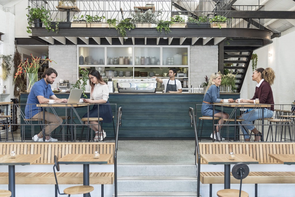 People sitting at tables in a restaurant